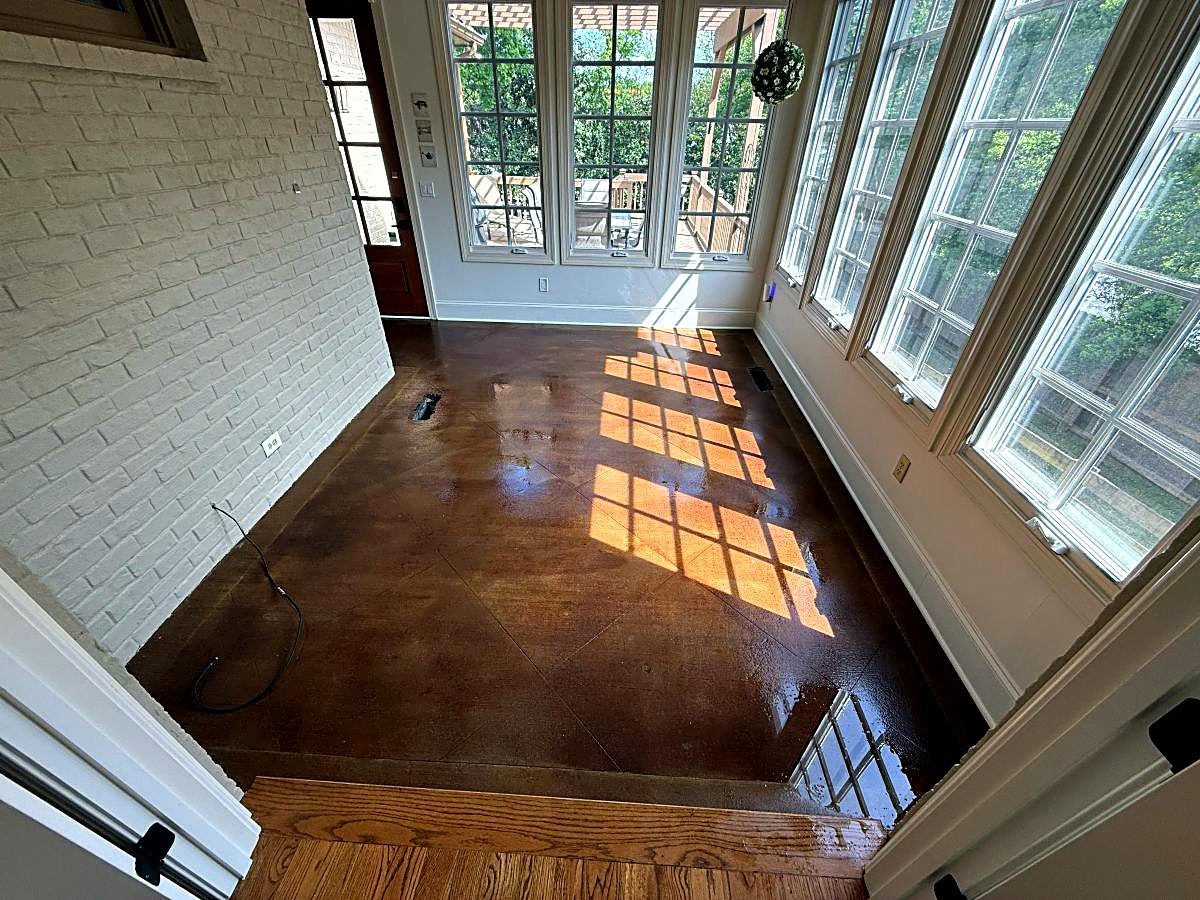 Glossy stained concrete floor in a sunroom